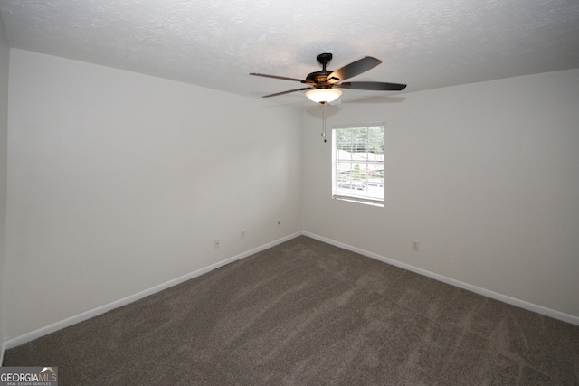3101 Reeves St SE, Smyrna, GA 30080 - unfurnished room with a ceiling fan, dark carpet, and a textured ceiling