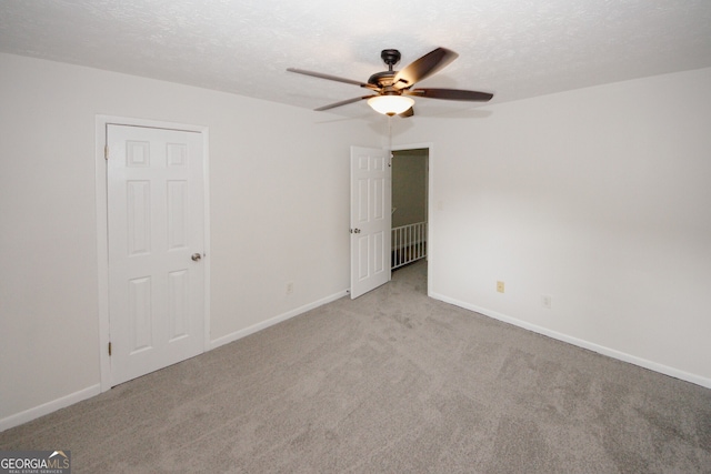 3101 Reeves St SE, Smyrna, GA 30080 - carpeted empty room with ceiling fan and a textured ceiling