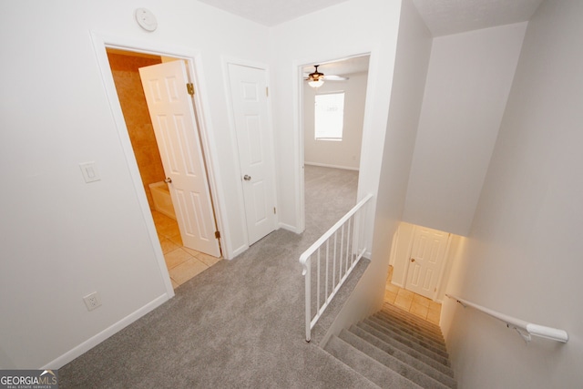 3101 Reeves St SE, Smyrna, GA 30080 - stairway with carpet and a ceiling fan
