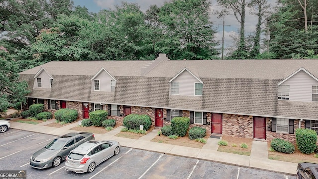 3101 Reeves St SE, Smyrna, GA 30080 - colonial inspired home with uncovered parking, brick siding, and a shingled roof