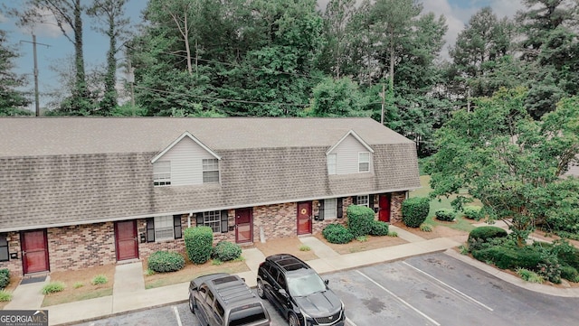 3101 Reeves St SE, Smyrna, GA 30080 - dutch colonial with brick siding, roof with shingles, and uncovered parking
