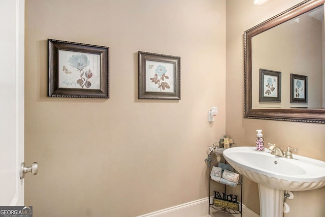 1209 Persimmon Way, Mcdonough, GA 30252 - bathroom with baseboards and a sink