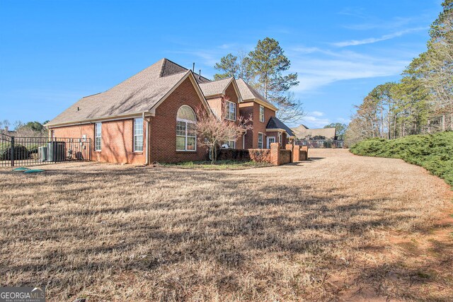 1209 Persimmon Way, Mcdonough, GA 30252 - back of house with brick siding and a shingled roof