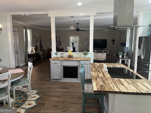 7191 Moontown Rd, Appling, GA 30802 - kitchen featuring butcher block countertops, black electric stovetop, stainless steel fridge, ornate columns, and crown molding