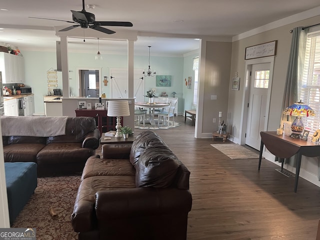 7191 Moontown Rd, Appling, GA 30802 - living room with dark wood finished floors, a ceiling fan, a chandelier, and ornamental molding