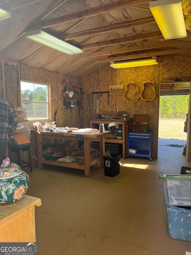 7191 Moontown Rd, Appling, GA 30802 - miscellaneous room with a workshop area, lofted ceiling, and concrete floors