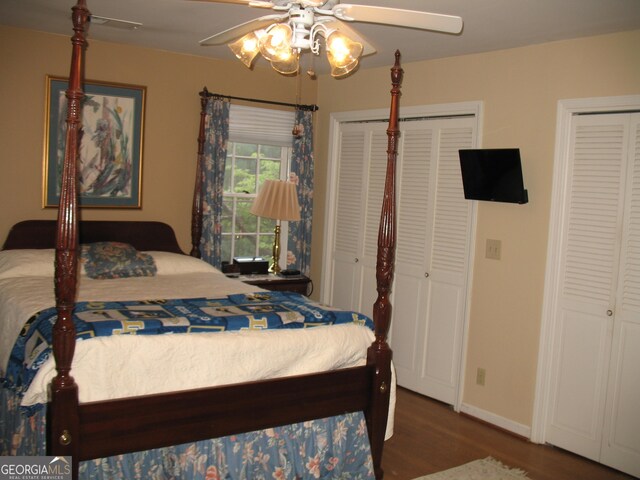 4098 Nancy Creek Way NE, Brookhaven, GA 30319 - bedroom with multiple closets, wood finished floors, and a ceiling fan