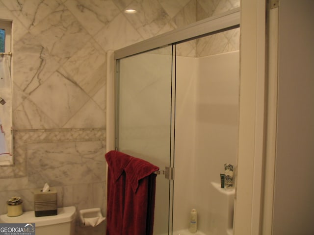 4098 Nancy Creek Way NE, Brookhaven, GA 30319 - bathroom with bath / shower combo with glass door and tile walls
