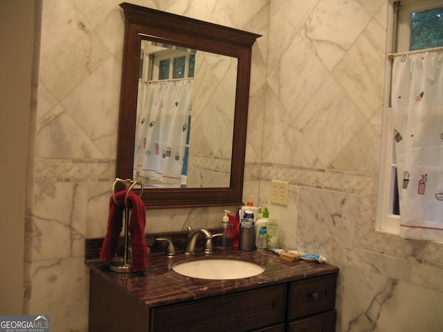 4098 Nancy Creek Way NE, Brookhaven, GA 30319 - bathroom featuring tile walls, vanity, and backsplash