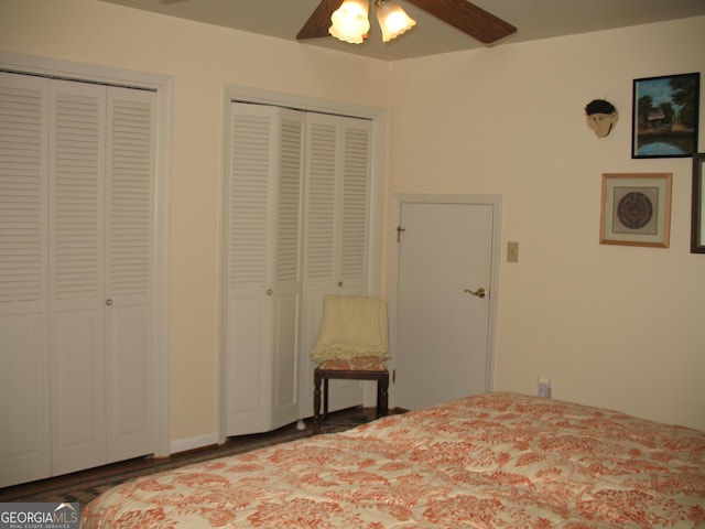 4098 Nancy Creek Way NE, Brookhaven, GA 30319 - bedroom featuring two closets, ceiling fan, and wood finished floors