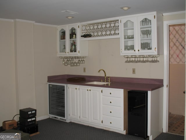 4098 Nancy Creek Way NE, Brookhaven, GA 30319 - indoor wet bar featuring wine cooler, ornamental molding, dark carpet, and refrigerator