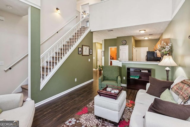 1714 Indian Way, Cumming, GA 30040 - living area featuring stairway and wood finished floors