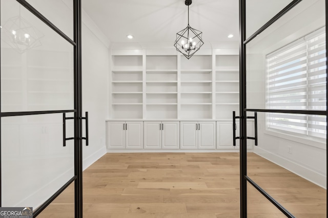 3735 Hamilton Mill Rd, Buford, GA 30519 - spacious closet with a chandelier and light wood finished floors