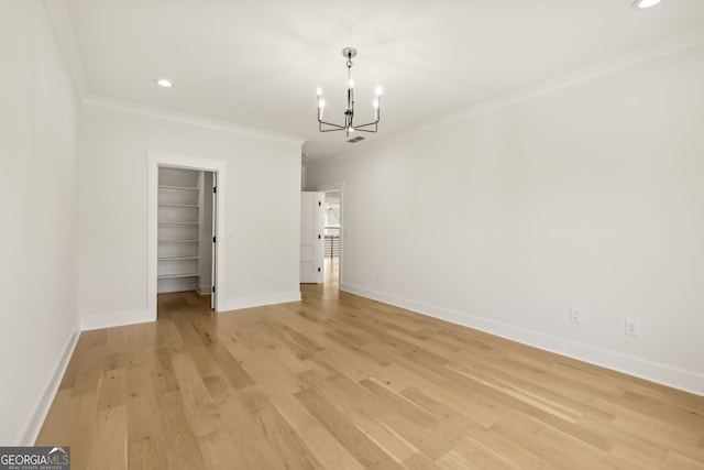 3735 Hamilton Mill Rd, Buford, GA 30519 - unfurnished bedroom featuring a chandelier, ornamental molding, light wood-type flooring, a spacious closet, and recessed lighting