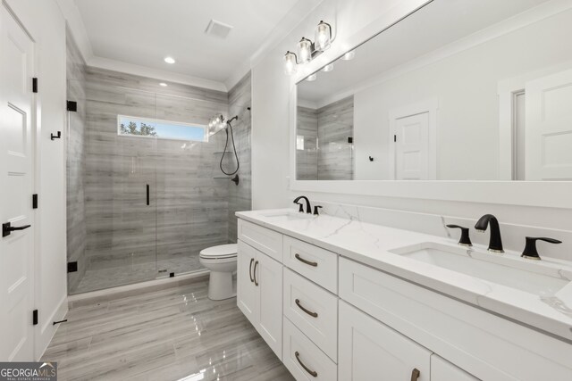 3735 Hamilton Mill Rd, Buford, GA 30519 - bathroom with double vanity, a shower stall, and recessed lighting