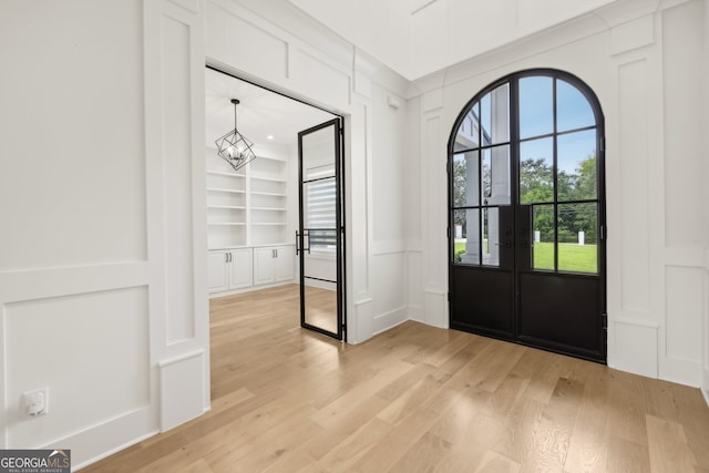 3735 Hamilton Mill Rd, Buford, GA 30519 - foyer with a decorative wall, light wood-type flooring, and a chandelier