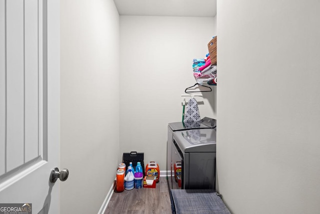 2046 Westbrook Rd, Commerce, GA 30530 - washroom with washing machine and dryer and wood finished floors