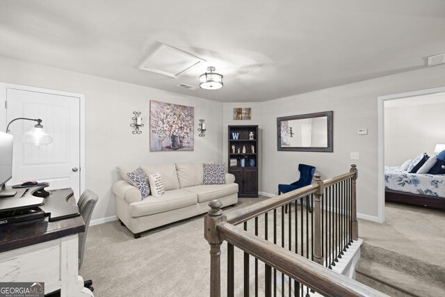 2046 Westbrook Rd, Commerce, GA 30530 - carpeted living area featuring baseboards and attic access