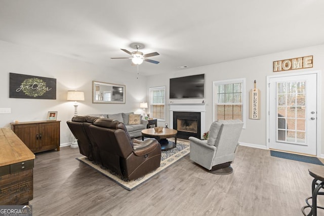 2046 Westbrook Rd, Commerce, GA 30530 - living room with wood finished floors, ceiling fan, and a fireplace