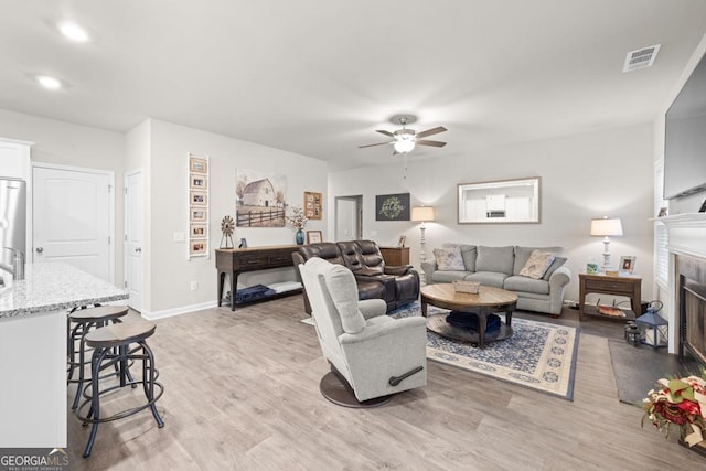 2046 Westbrook Rd, Commerce, GA 30530 - living area featuring ceiling fan, light wood-style flooring, a fireplace, and recessed lighting