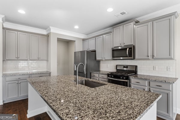 1494 Weeping Tree Cir, Hoschton, GA 30548 - kitchen featuring stainless steel appliances, gray cabinetry, crown molding, and recessed lighting