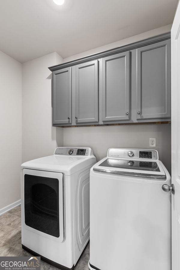 1494 Weeping Tree Cir, Hoschton, GA 30548 - washroom with separate washer and dryer and cabinet space