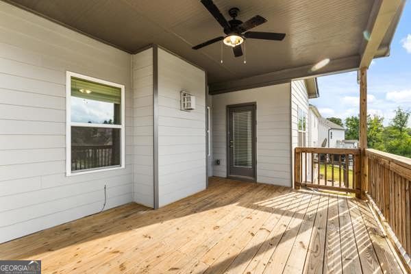 1494 Weeping Tree Cir, Hoschton, GA 30548 - wooden terrace with ceiling fan