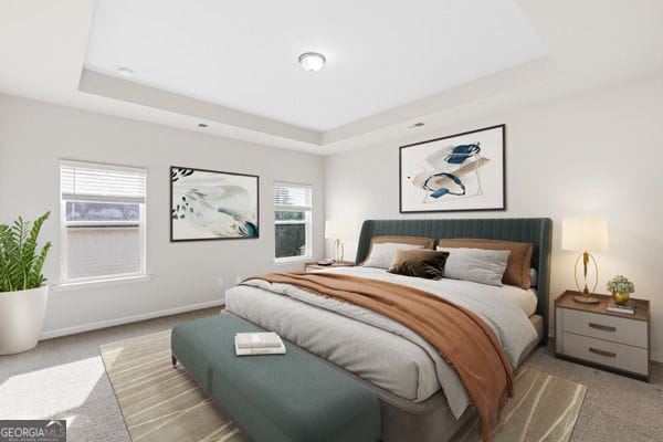1494 Weeping Tree Cir, Hoschton, GA 30548 - carpeted bedroom with a tray ceiling