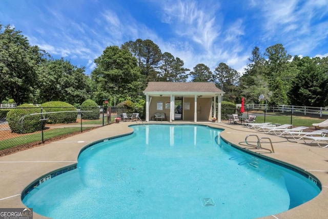 3820 Pheasant Run Trce, Cumming, GA 30028 - community pool with a patio area and view of scattered trees