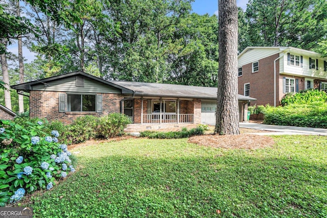 1260 Fork Creek Trl, Decatur, GA 30033 - view of front facade featuring covered porch, concrete driveway, brick siding, and a garage