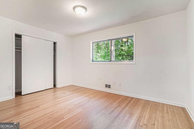 1260 Fork Creek Trl, Decatur, GA 30033 - unfurnished bedroom featuring light wood-style floors and a closet