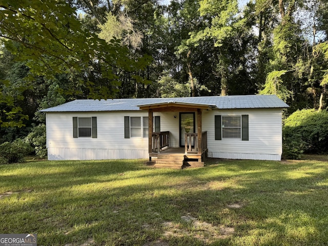 919 Louis Rd, Rentz, GA 31075 - manufactured / mobile home with a front lawn and a metal roof