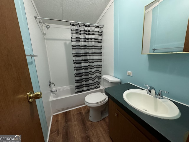 919 Louis Rd, Rentz, GA 31075 - bathroom with wood finished floors, a textured ceiling, vanity, and shower / tub combo with curtain