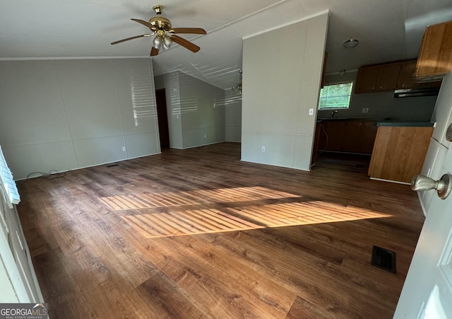 919 Louis Rd, Rentz, GA 31075 - unfurnished living room featuring a ceiling fan, dark wood-style flooring, vaulted ceiling, and crown molding