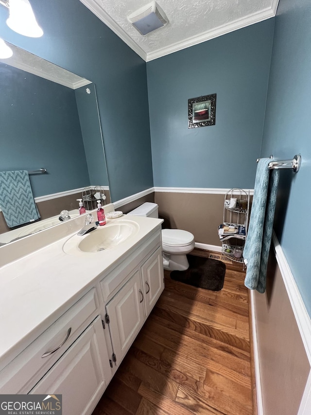 186 Kingston Rd, Colbert, GA 30628 - bathroom featuring vanity, wood finished floors, ornamental molding, and a textured ceiling