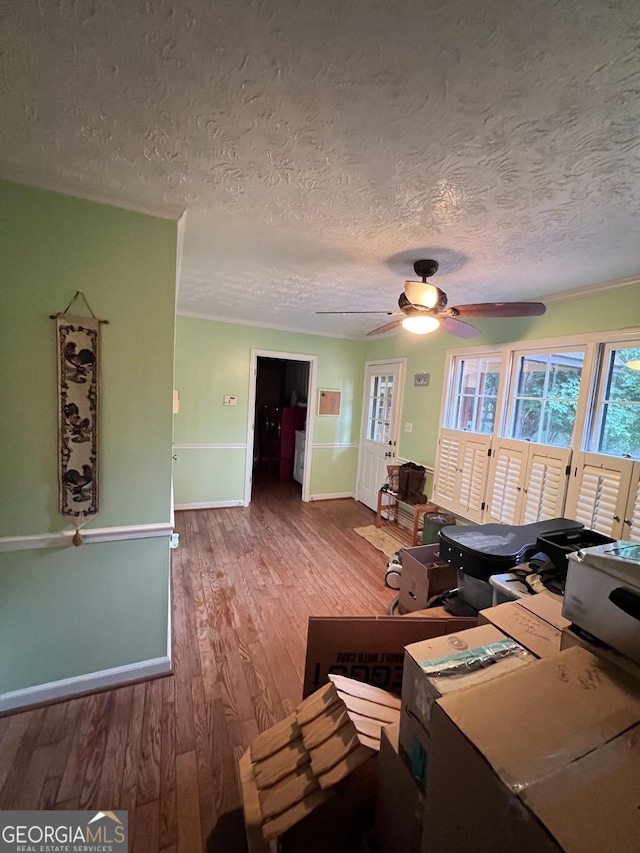 186 Kingston Rd, Colbert, GA 30628 - living room with wood finished floors, ceiling fan, and a textured ceiling