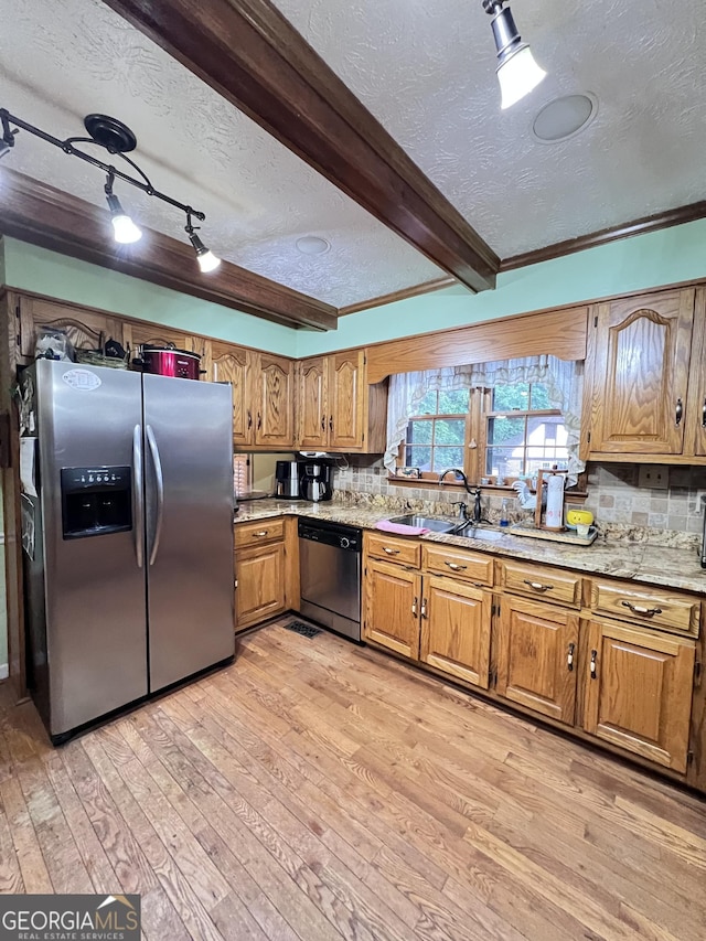 186 Kingston Rd, Colbert, GA 30628 - kitchen featuring stainless steel appliances, a textured ceiling, light wood-type flooring, brown cabinets, and backsplash