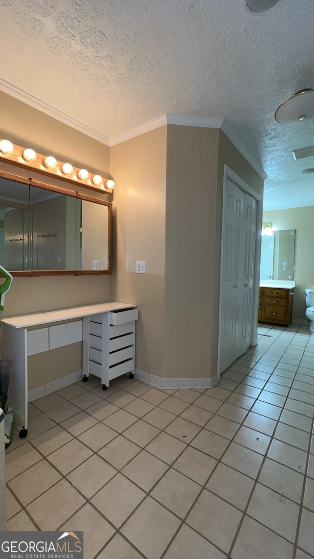 186 Kingston Rd, Colbert, GA 30628 - bathroom with vanity, a textured ceiling, ornamental molding, and tile patterned floors