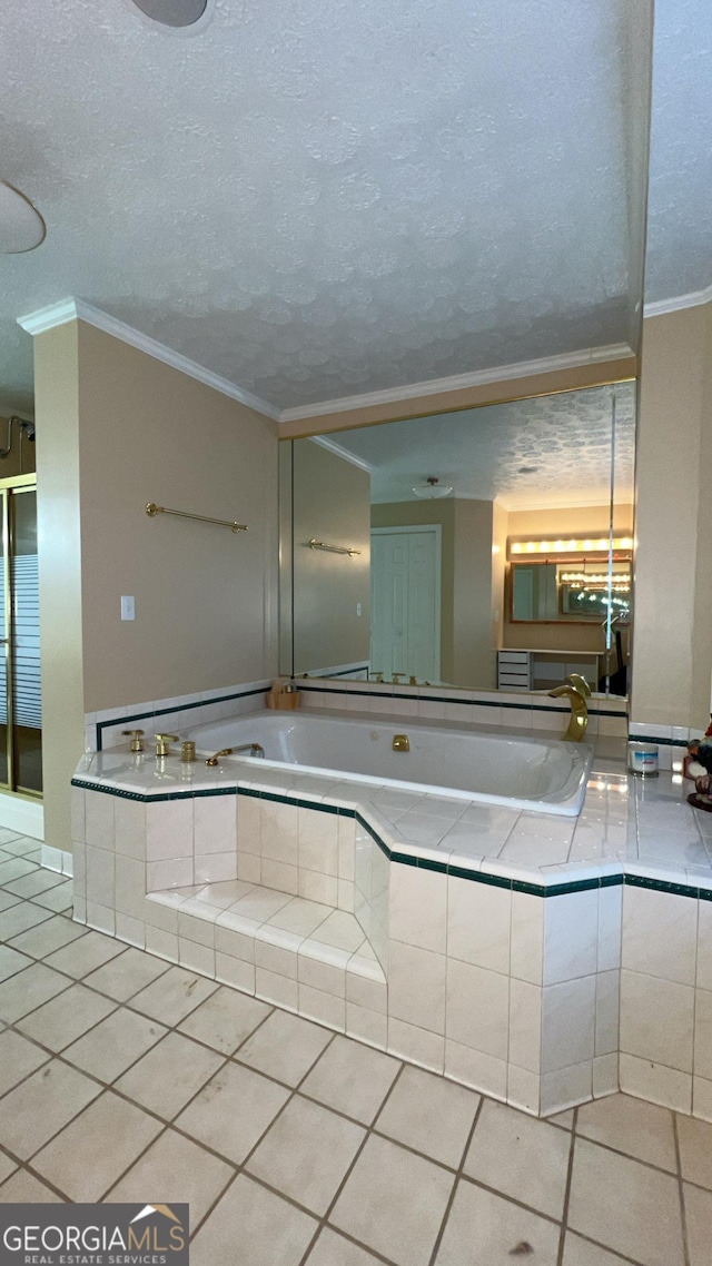 186 Kingston Rd, Colbert, GA 30628 - bathroom featuring tile patterned flooring, ornamental molding, a textured ceiling, and a garden tub