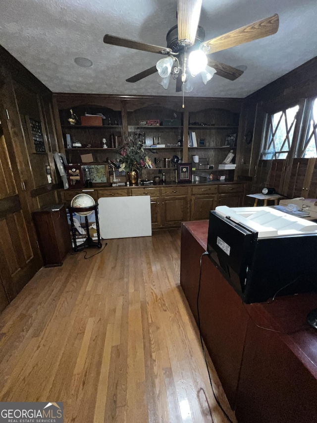 186 Kingston Rd, Colbert, GA 30628 - kitchen featuring light wood-style floors, open shelves, and ceiling fan