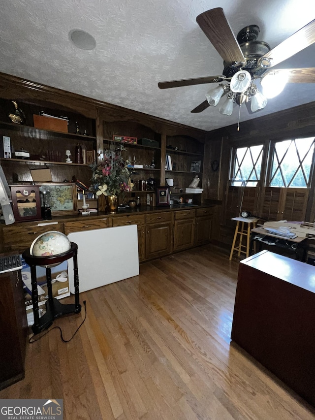 186 Kingston Rd, Colbert, GA 30628 - kitchen featuring ceiling fan, wood finished floors, open shelves, and dark countertops