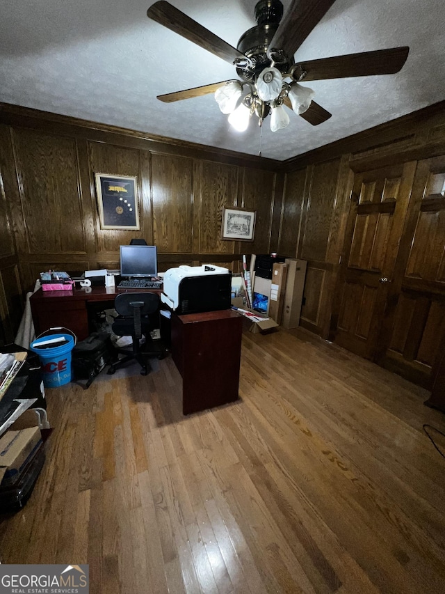 186 Kingston Rd, Colbert, GA 30628 - office area with hardwood / wood-style flooring, ceiling fan, and wooden walls