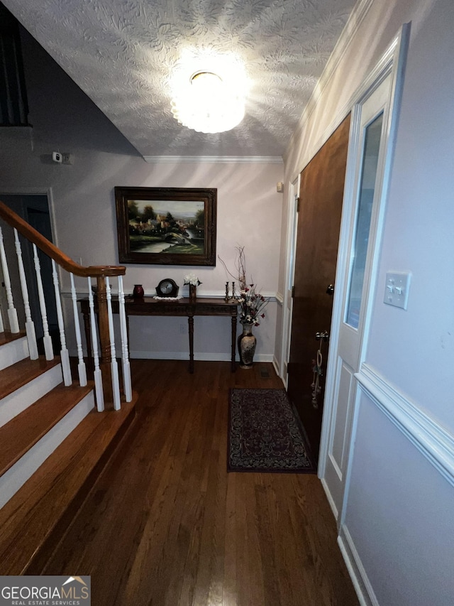 186 Kingston Rd, Colbert, GA 30628 - entrance foyer featuring a textured ceiling, dark wood-style flooring, and stairs