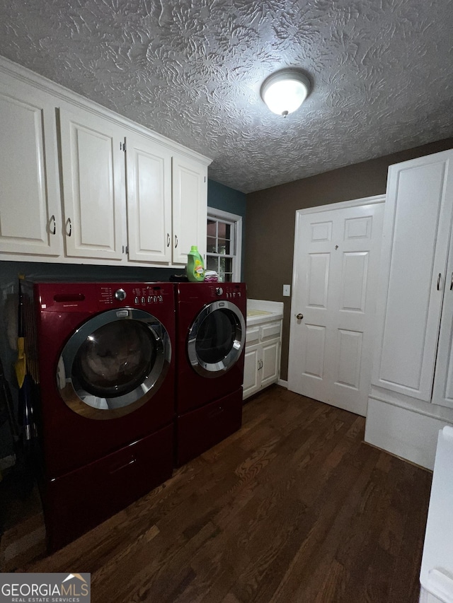 186 Kingston Rd, Colbert, GA 30628 - laundry room featuring cabinet space, washer and clothes dryer, dark wood finished floors, and a textured ceiling