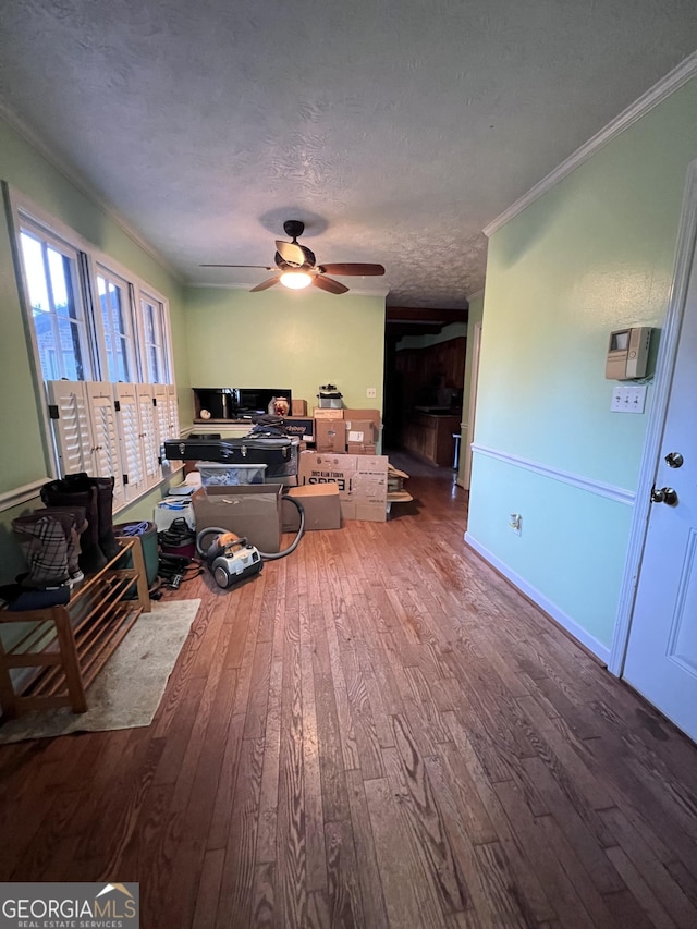 186 Kingston Rd, Colbert, GA 30628 - living room with wood finished floors, crown molding, a ceiling fan, a desk, and a textured ceiling