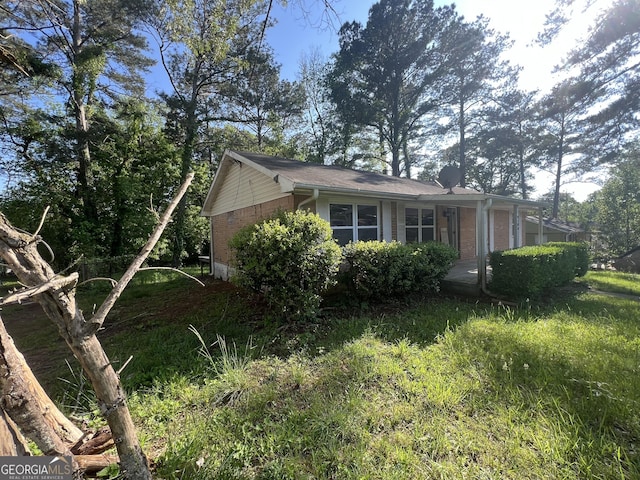 7128 Lady Heidi Ct, Jonesboro, GA 30236 - view of side of property featuring brick siding