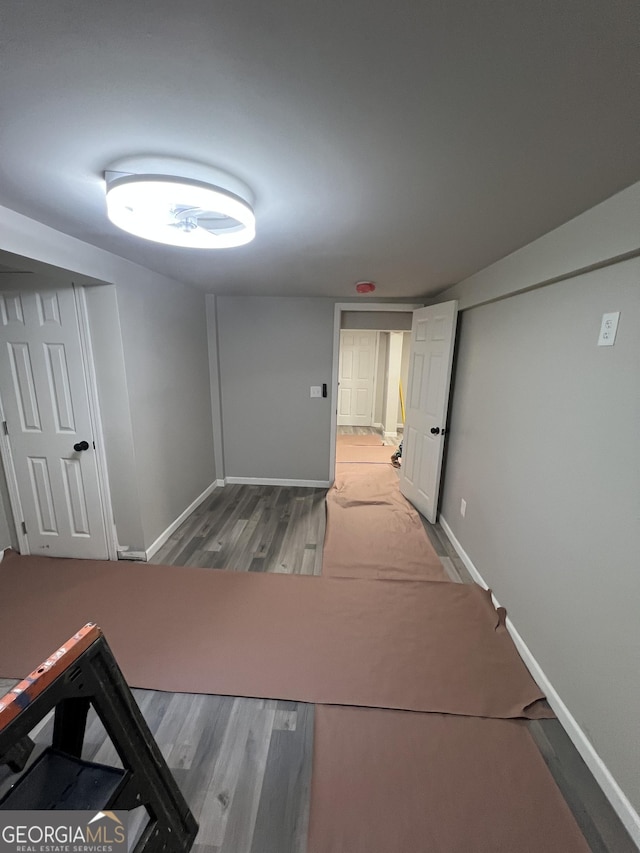 7128 Lady Heidi Ct, Jonesboro, GA 30236 - corridor featuring wood finished floors and baseboards