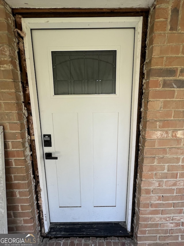 7128 Lady Heidi Ct, Jonesboro, GA 30236 - view of exterior entry featuring brick siding