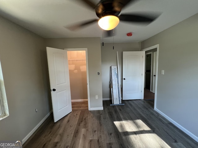 7128 Lady Heidi Ct, Jonesboro, GA 30236 - unfurnished bedroom featuring wood finished floors and a ceiling fan