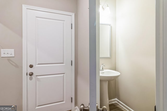105 Ivy Glen Dr, Perry, GA 31069 - bathroom featuring baseboards and wood finished floors